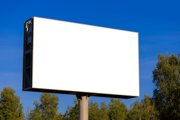 Background for design, white billboards on city streets and along roads in the summer day