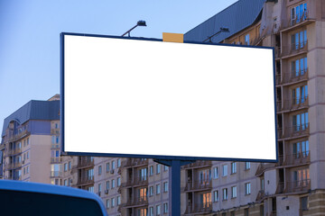 Background for design, white billboards on city streets and along roads in the summer day