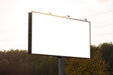 Background for design, white billboards on city streets and along roads in the summer day