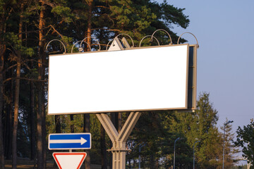Background for design, white billboards on city streets and along roads in the summer day