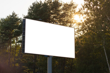 Background for design, white billboards on city streets and along roads in the summer day