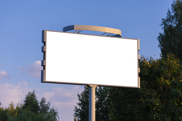 Background for design, white billboards on city streets and along roads in the summer day