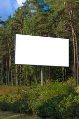 White billboard along the highway. Background for design and advertising. 