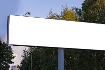 White billboard along the highway. Background for design and advertising. 