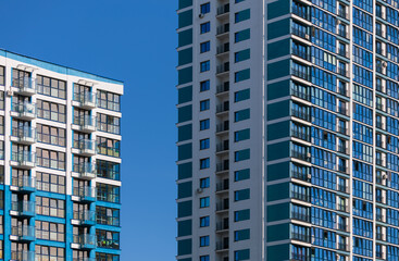 Fototapeta premium City view on a sunny day. Modern buildings, walls and windows. 