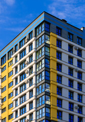 Modern buildings, walls and windows. City view on a sunny day. 