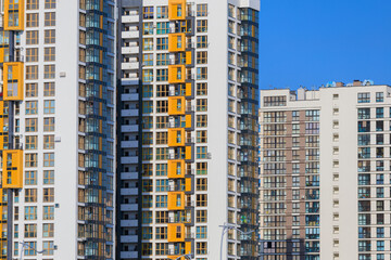 City view, modern buildings and skyscrapers against the blue sky.