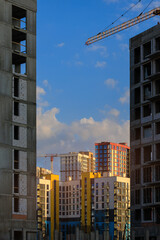 Fototapeta premium City view, modern buildings and skyscrapers against the blue sky.