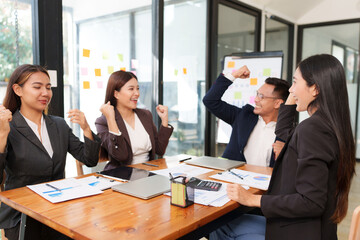 Group of Asian businessmen are sitting in a meeting, talking, exchanging knowledge. Presentation about office work