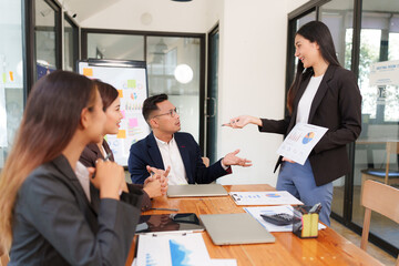 Group of Asian businessmen Sitting in meetings, talking, exchanging knowledge, presenting work.