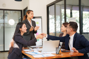 Group of Asian businessmen Sitting in meetings, talking, exchanging knowledge, presenting work.