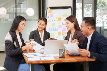 Group of Asian businessmen Sitting in meetings, talking, exchanging knowledge, presenting work.