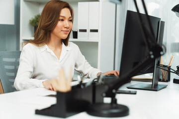 Obraz premium Portrait of beautiful businesswoman working on computer for checking email for sales report highest profit in casual day at modern office in young making startup business challenge concept. Infobahn.