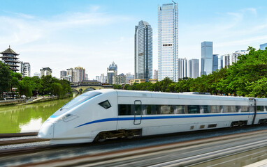 Naklejka premium High-speed rail speeds on Bridges and the modern city skyline of chongqing, China