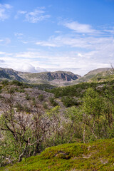 Rocky landscape against the backdrop of clouds and lakes, tundra and rocky mountains, Norway.