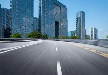 Fototapeta premium Dynamically blurred highways and the skyline of Hangzhou, China