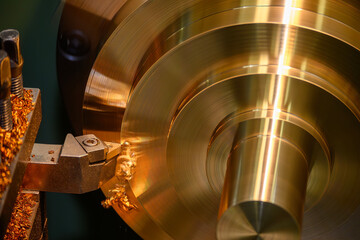The lathe machine finish cut the brass material parts by lathe tools.