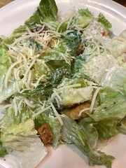 A delicious Cesar salad on a white plate. 