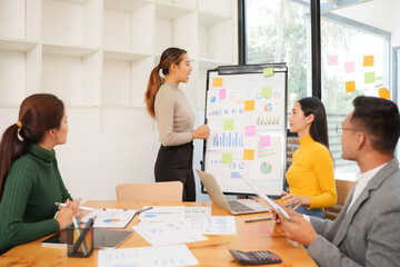 Asian Business Group Chat about graph work Present in meetings, in the office