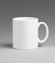 Obraz premium a plain white ceramic mug on a gray background