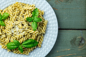 Pasta with basil sauce pesto . Italian food photography . Top view