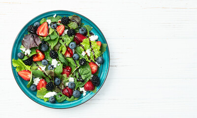 Berries salad (blueberry strawberry blackberry ) with cheese feta and balsamic sauce