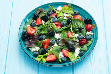 Berries salad (blueberry strawberry blackberry ) with cheese feta and balsamic sauce