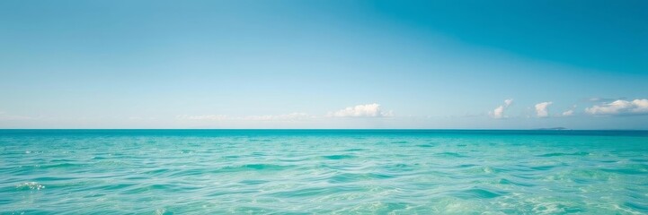 Obraz premium Beautiful and serene ocean background with clear blue water and fluffy white clouds in the sky, blue, marine