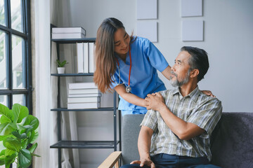 Young nurse provides compassionate care to a senior man at his home, offering comfort and support...