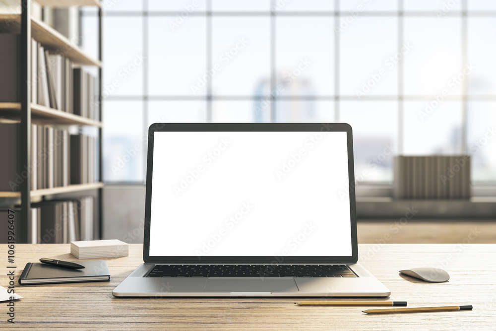 Poster front view on modern laptop blank white monitor with place for your text or logo on light wooden tab