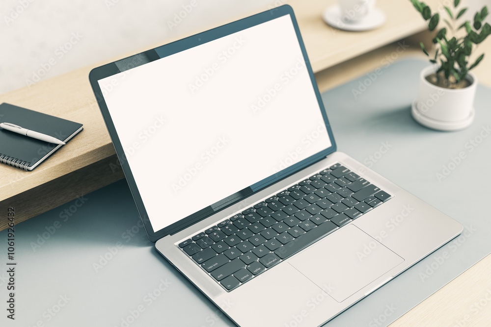 Poster Perspective view from top on blank white modern laptop screen with copyspace for your logo or text on light grey table with green plant and notebook on wooden shelf. 3D rendering, mock up