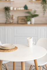 bright kitchen with wooden countertop and table in the middle of the room