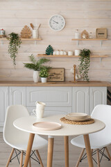 bright kitchen with wooden countertop and table in the middle of the room