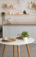 bright kitchen with wooden countertop and table in the middle of the room