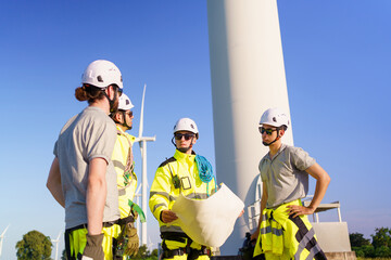 Team of electrical engineer is perform the inspection and maintenance of electric generating windmill turbine.