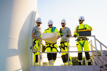 Team of electrical engineer is perform the inspection and maintenance of electric generating windmill turbine.