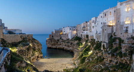 Obraz premium The Lama Monachile Bay night view in Polignano a Mare Town of Italy