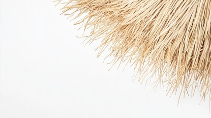 Obraz premium Rustic-style straw umbrella with visible texture on a seamless white background