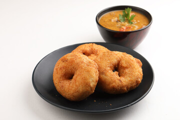Traditional breakfast of South India IDLY VADA served with sambar Chutney in a ceramic plate