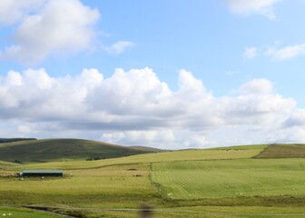 English countryside fields with clouds