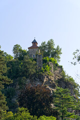 Looking up Zeno Castle on top of rock at Passer Passirio River seen from Italian City of Meran on a sunny summer day. Photo taken July 18th, 2024, Merano Meran, Italy.