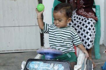 child playing with toy car