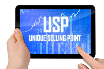 Tablet with hands and with acronym USP unique selling proposition or unique selling point isolated