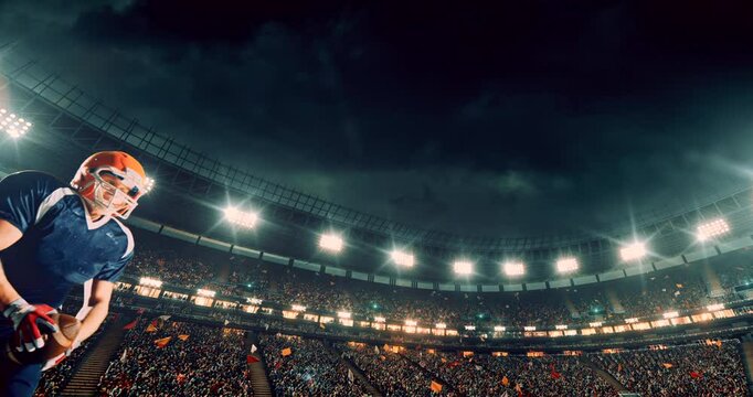 This video captures a dramatic moment in an American football game as a player in a blue jersey dives mid-air to catch the ball. The bright stadium lights and cheering crowd amplify the intensity and 