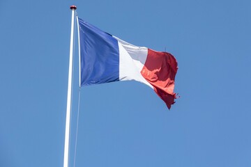 The national flag of France (French: drapeau francais) is a tricolour featuring three vertical bands coloured blue (hoist side), white, and red