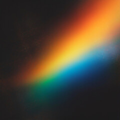 Blurred Warm Rainbow Light Leaks with Dust Texture on Black Background