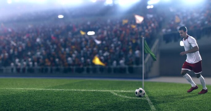 A football player in a white jersey prepares to take a corner kick during an intense match. The vibrant crowd cheers in a packed stadium under bright lights, creating a thrilling atmosphere