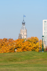 The tower of the Quebec parliament with in foreground the battlefields park of the plains of...