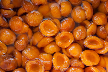 Cooking apricot jam healthy food background
