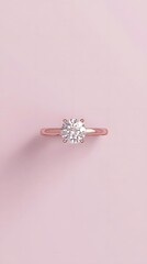 A minimalist product shot of an engagement ring with a rose gold band and round diamond, centered on a soft pastel background.
